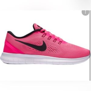 Nike Free RN running shoes pink with black accents tennis shoes